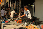 Boy selling chain saws