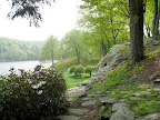 Tightly clipped and sculpted cherry trees provide a visual anchor and a frame of reference as you walk around the lake.