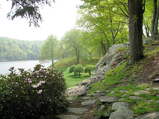 Tightly clipped and sculpted cherry trees provide a visual anchor and a frame of reference as you walk around the lake.