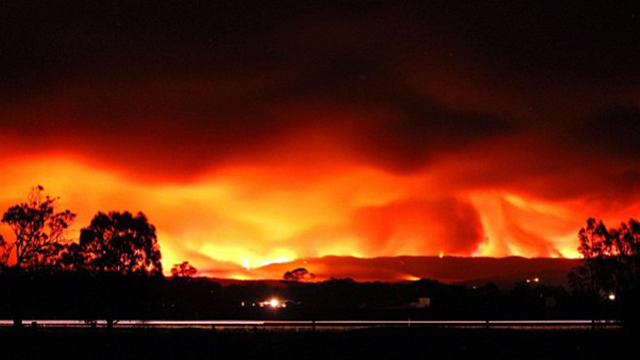 Fire storms over a hill at Maffra in Gippsland, Australia, Januray 2013. Photo: Simon Noble / Instagram