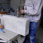 6 - Manual bush hammering of a chiselled door sill