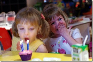 This is my favorite.  Quinn is waiting for the right opportunity to sneak in and get those candles!  And E thinks the entire thing is extremely funny!
