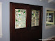 Custom entry door with clear GNA bevels and fused and beveled leaves and branch in brushed lead came.