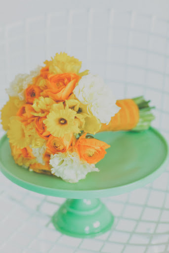 A bouquet of daffodils and ranunculus.