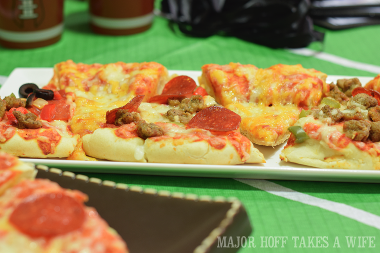 Boys love an assortment of pizza. Looking for a fun party for your teenage boy? Why not throw a Football video game party? Easy ideas for how to entertain kiddos during the Big Game. Features DiGiorno pizza, personalized football cups, free printable lanyards, and an incredible recipe for football shaped ice cream sandwiches! #GameTimeMVP #CollectiveBias #ad Boys love an assortment of pizza. Looking for a fun party for your teenage boy? Why not throw a Football video game party? Easy ideas for how to entertain kiddos during the Big Game. Features DiGiorno pizza, personalized football cups, free printable lanyards, and an incredible recipe for football shaped ice cream sandwiches! #GameTimeMVP #CollectiveBias #ad