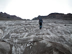 Almost to Muir. Public hut is castle looking building left of the dip in the ridge.