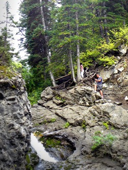 Sara and Curtis climbing up to the top of Donut Falls