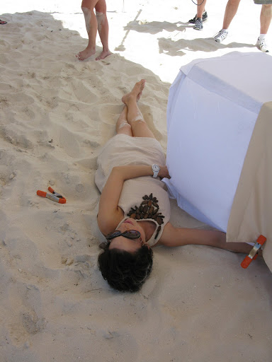 Making sure we got the perfect shot, we all took one for the team and layed in the sand to keep the tablecloth from blowing away.