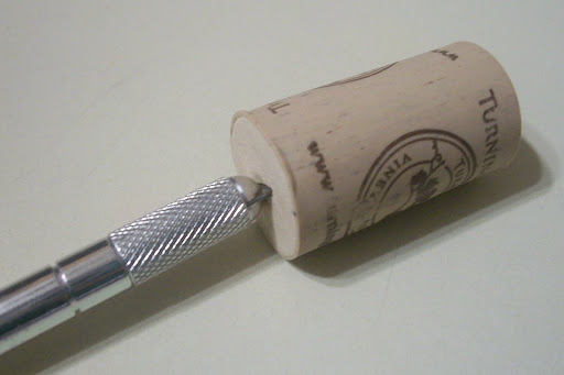 Protect yourself with a cork as a blade guard.