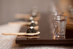 Cavier on an edible spoon is perfectly paired with a vodka chaser.