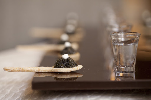 Cavier on an edible spoon is perfectly paired with a vodka chaser.
