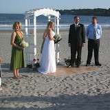 Lew and Cheryl, getting married on a piece of plywood in the sand