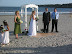 Lew and Cheryl, getting married on a piece of plywood in the sand Lew and Cheryl, getting married on a piece of plywood in the sand