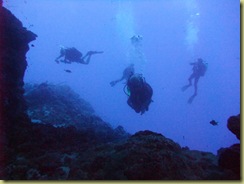 Divers heading for the cave