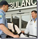 Kyle McClaine, MD, talks to John Gold from Plainfield Ambulance outside of the entrance to the Backus ED. On Monday Dr. McClaine, who works in the Backus Emergancy Department,  will be presented a prestigious statewide award for collaboration with Emergency Medical Services in the community