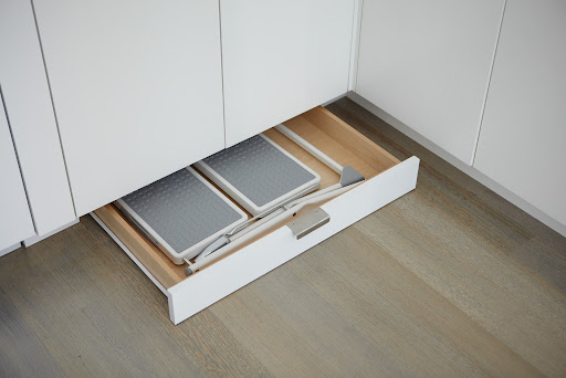 This is another storage trick I love. Utilize the wasted space behind a cabinet toe kick by building in drawers. Bob Tobin, my contractor, from BC Interiors, Ltd., built this one in my kitchen for a small step stool. This is another storage trick I love. Utilize the wasted space behind a cabinet toe kick by building in drawers. Bob Tobin, my contractor, from BC Interiors, Ltd., built this one in my kitchen for a small step stool.
