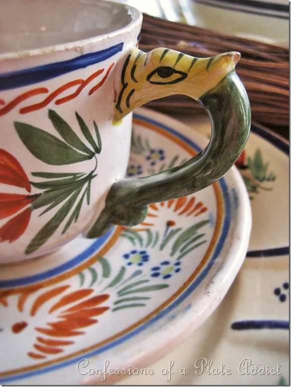 Quimper cup and saucer with dragon handle
