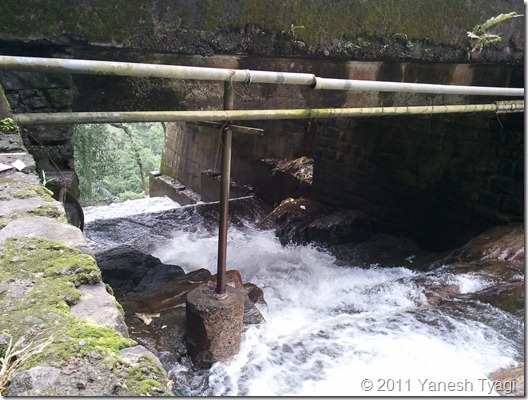 041. The water of Cheyappara waterfall makes its way below the bridge at NH49