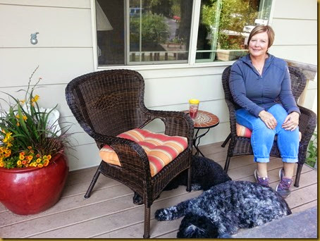 Enjoying the front porch with Rico and Jetta pam on frotn porch