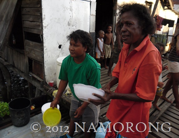 WOMEN DOING THE DISHES AT ELEVALA