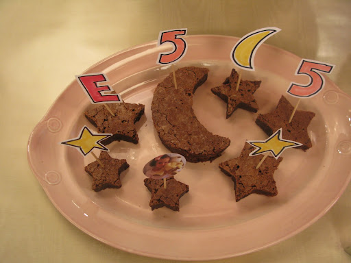Darcy used cookie cutters to make brownies in moon and star shapes. She decorated them with pictures and drawings mounted on toothpicks.