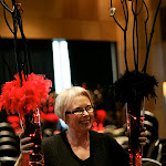 A happy florist showing off her arrangements. A happy florist showing off her arrangements.