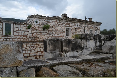 Stratonikeia House beyond bouleterion ruins Stratonikeia House beyond bouleterion ruins