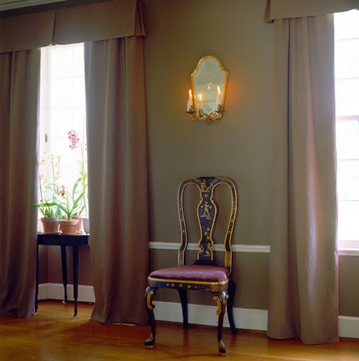 I love the combination of the plum-colored upholstery with this wall color. (Martha Stewart Living)