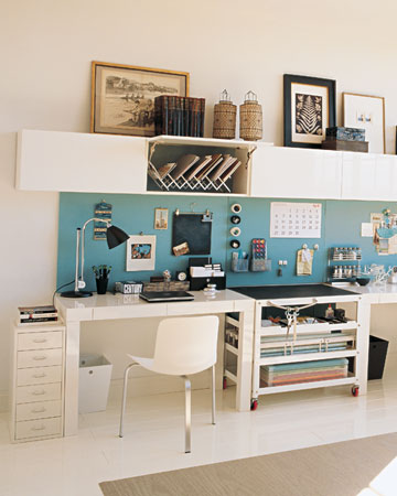 I really like the long expanse of bulletin board shown in this office.