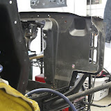 Panel mostly removed, looking from the right side of the car towards the front.