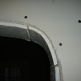 When attached, the drywall cracks along the slits to match the curve of the framing