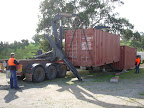 Loading 10t container onto side loader transport at One Tree Hill, Adelaide, South Australia