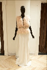 This wedding dress is accessorized with a Mongolian fur vest and sparkly bow belt. This wedding dress is accessorized with a Mongolian fur vest and sparkly bow belt.
