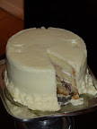 The first (and only) slice was cut. You can actually see the indents on the top where our cake topper was placed.
