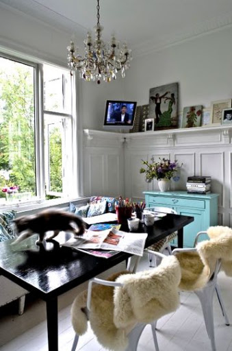 The blue drawers are pretty with the clean white walls and the black desk. via Apartment Therapy.