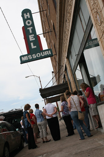 Students gather outside the hotel and take a few moments to reflect on the generosity of the community. (photo credit: James Mulvenon)