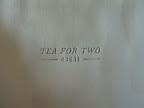 A letterpressed wood veneer envelope held tea bags.