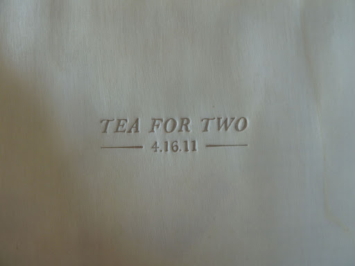 A letterpressed wood veneer envelope held tea bags.