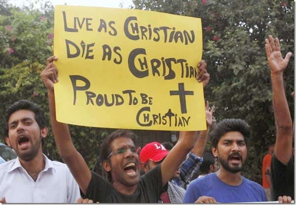 A member of the Pakistani Christian community holds a placard as he shouts slogans during a protest rally to condemn Sunday's suicide attack in Peshawar on a church, with others in Lahore September 23, 2013 A member of the Pakistani Christian community holds a placard as he shouts slogans during a protest rally to condemn Sunday's suicide attack in Peshawar on a church, with others in Lahore September 23, 2013