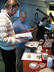 Sirius XM online editor Scott Frampton, left, and Living Today engineer Chris Hauselt set about finding inspiration for their decoupage. Maura Madden, right, is our crafting mistress.