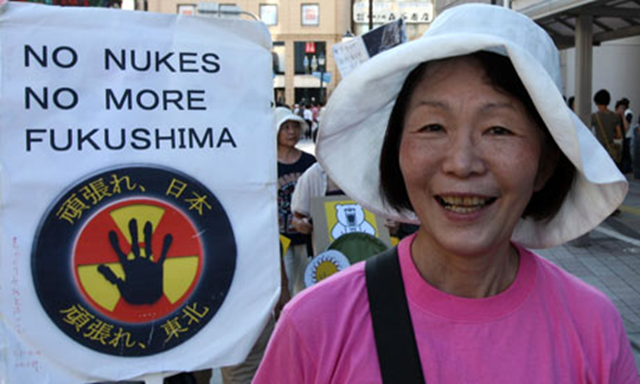 A Japanese activist takes part in an anti-nuclear protest in Kobe, March 2012. A recent poll shows that nearly 70% of the public want to reduce or end the use of nuclear power. Buddhika Weerasinghe / Getty Images