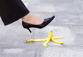 Female executive and banana skin