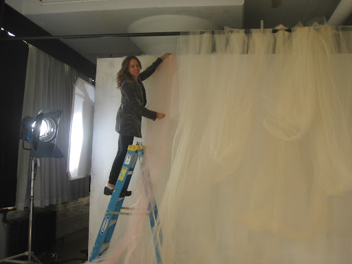 Melissa hanging some tulle and testing out the soft colors together