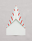 Fold corners in a second time, bringing upper sides to meet at the middle. Fold corners in a second time, bringing upper sides to meet at the middle.
