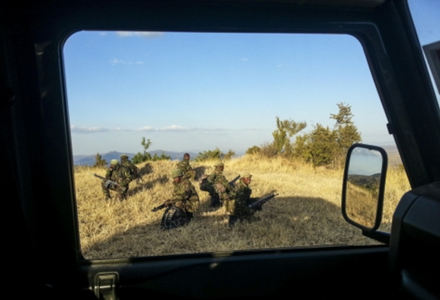 An armed anti-poaching unit out on patrol in the Borana wildlife sanctuary. Photo: Michael Dyer / SCMP