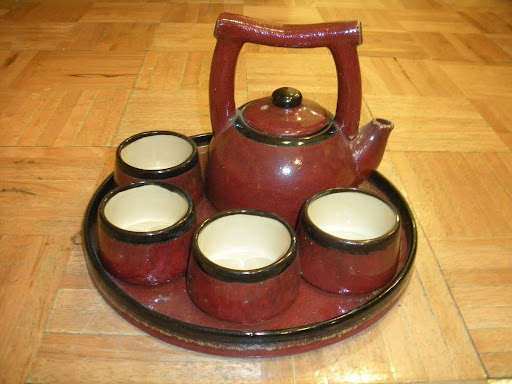 An earthenware ceramic tea set in a beautiful ruby hue.