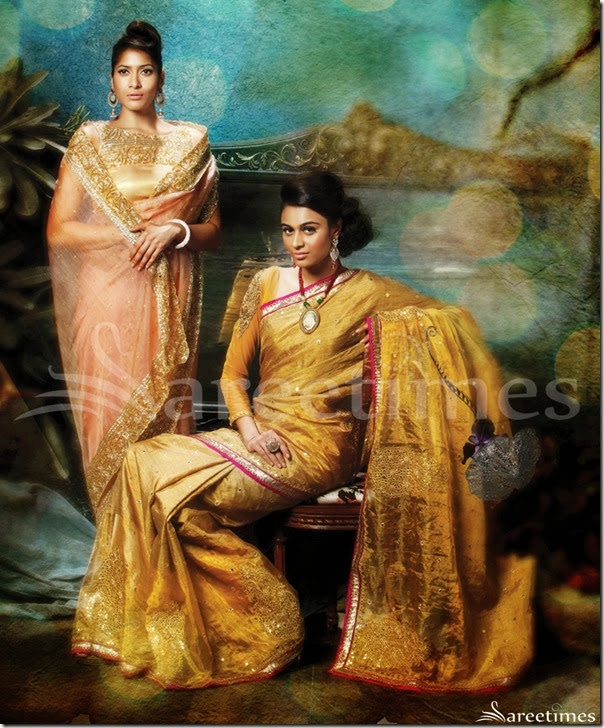 LD-32: This peach glass tissue saree is encrusted with sparkling kundans, bugle beads and nakshi and is couple with an equally embellished blouse. The sequin and stone studded border gives a royal retreat to this masterly crafted piece. Small circular motifs are scattered throughout its body to add a dash of bling.LD-33: This half & half gold woven saree represents the perfect blend of jute and tissue. The border is outlined with lurex lace and a contrast Dupion fabric. Bold Gota Patti floral motifs accentuate the bottom half of the drape. LD-32: This peach glass tissue saree is encrusted with sparkling kundans, bugle beads and nakshi and is couple with an equally embellished blouse. The sequin and stone studded border gives a royal retreat to this masterly crafted piece. Small circular motifs are scattered throughout its body to add a dash of bling.LD-33: This half & half gold woven saree represents the perfect blend of jute and tissue. The border is outlined with lurex lace and a contrast Dupion fabric. Bold Gota Patti floral motifs accentuate the bottom half of the drape.