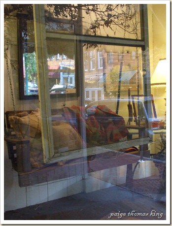 porch swing, burlap eco pillows, and window screen