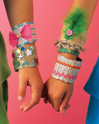 Bangles made with slices of paper towel tubes are a fun and easy party craft! Link below.