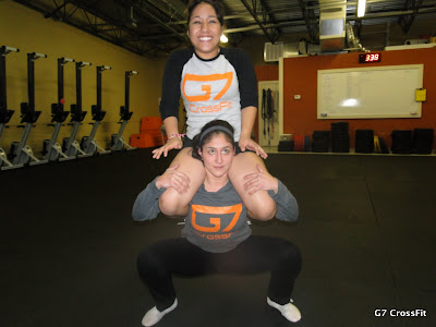Forget the olympic bar.  Squat your friend!